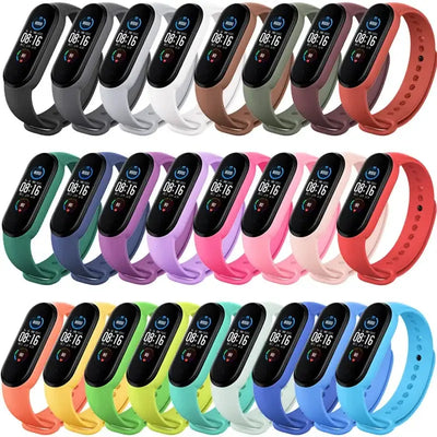 Set of colorful silicone wristbands for Xiaomi Mi Band 3-6. Durable and adjustable replacement straps for smartwatches in multiple colors.