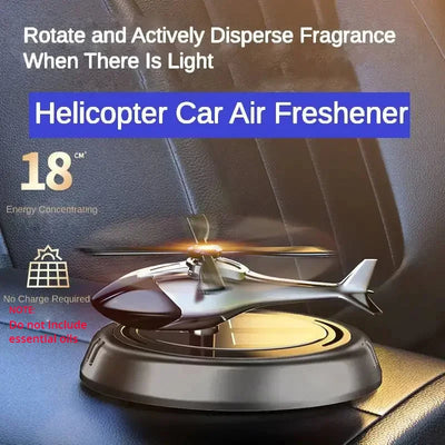 Solar-powered helicopter car air freshener with rotating blades, dispersing fragrance when exposed to light. Stylish car interior accessory.