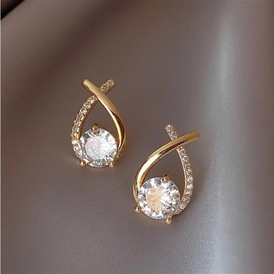 Elegant gold-tone rhinestone earrings with a delicate cross stud design, featuring sparkling zircon stones. Perfect for parties and daily wear.